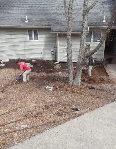 crew working on rock landscaping